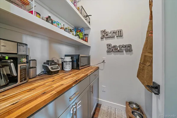 a kitchen with stainless steel appliances granite countertop a sink and wooden cabinets