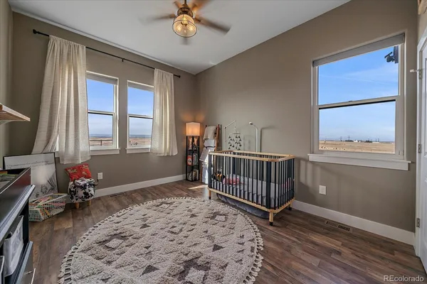 a bedroom with furniture and windows