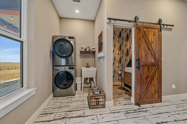 a view of a hallway with washer and dryer