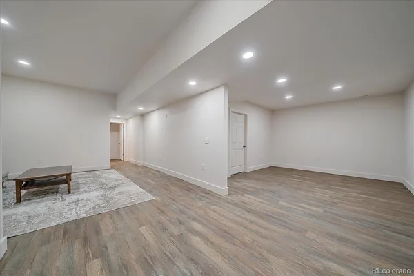 an empty room with wooden floor