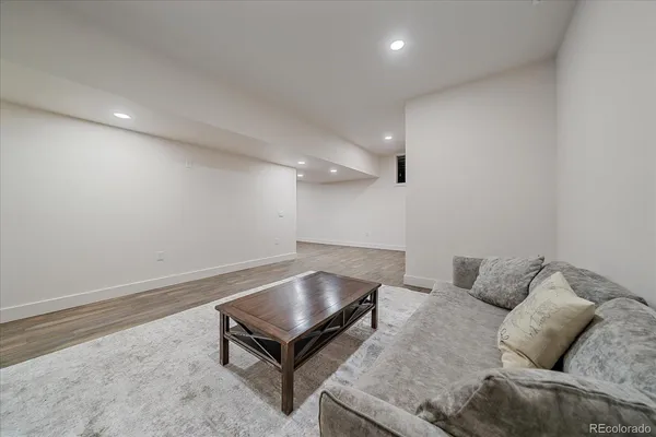 a living room with furniture and a table