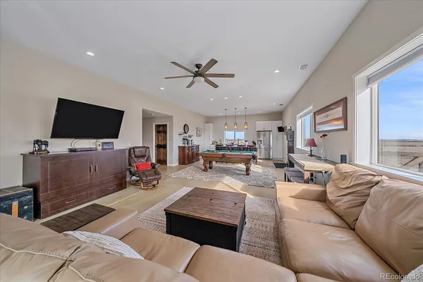 a large kitchen with a table and chairs