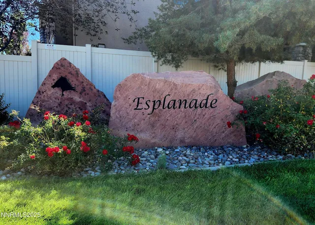 a front view of a house with plants