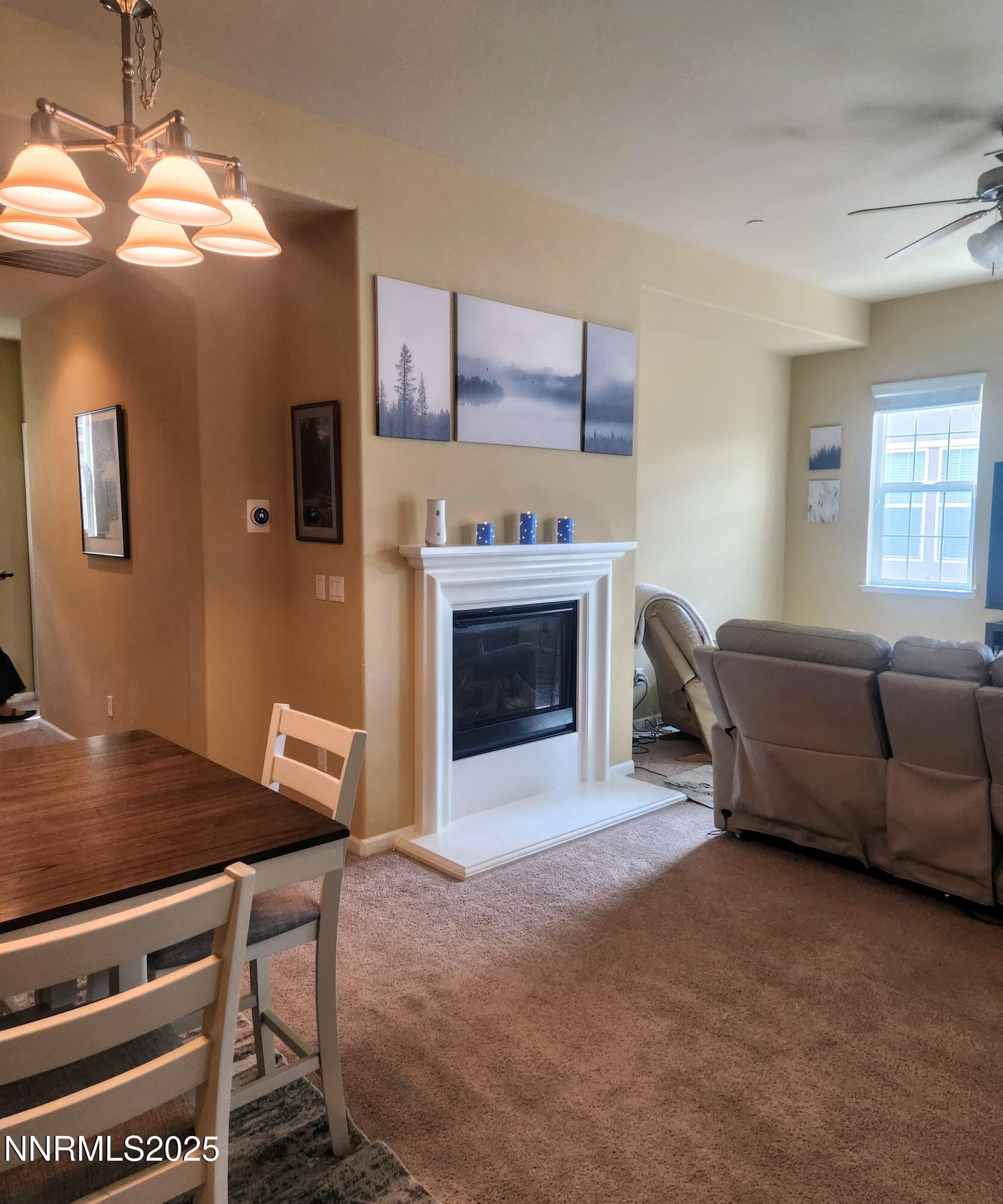 1828 Wind Ranch Road, Unit C Reno, NV 89521 - Photo 4 of 6 a living room with furniture and a fireplace