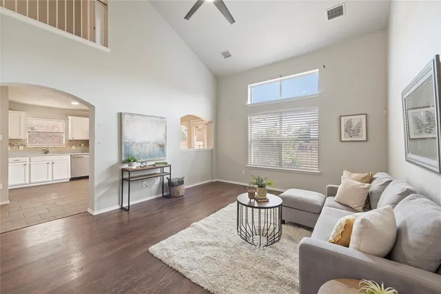 a living room with furniture and a table