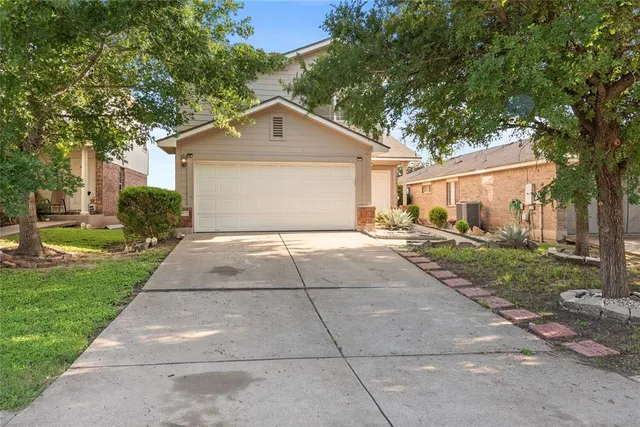 a front view of a house with yard