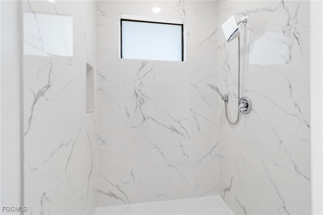 1152 Randolph Street Lehigh Acres, FL 33974 - Photo 21 of 50 a bathroom with a shower