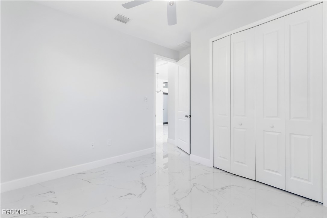 1152 Randolph Street Lehigh Acres, FL 33974 - Photo 26 of 50 a view of an empty room