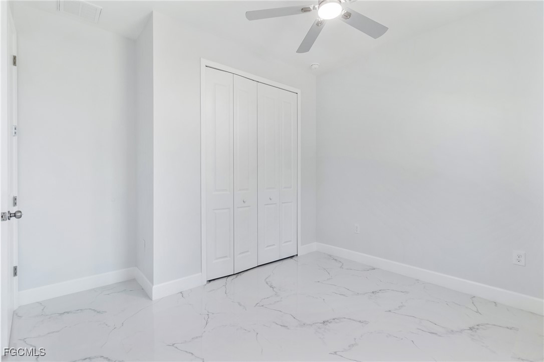 1152 Randolph Street Lehigh Acres, FL 33974 - Photo 27 of 50 a view of an empty room