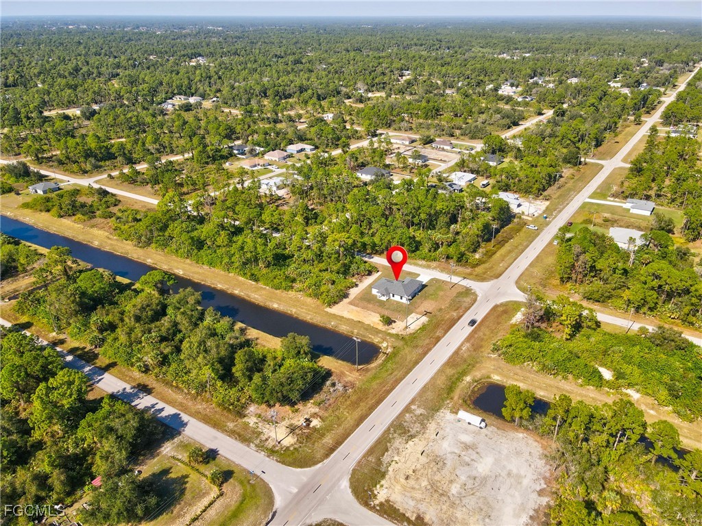 1152 Randolph Street Lehigh Acres, FL 33974 - Photo 35 of 50 a view of an outdoor space and a lake view