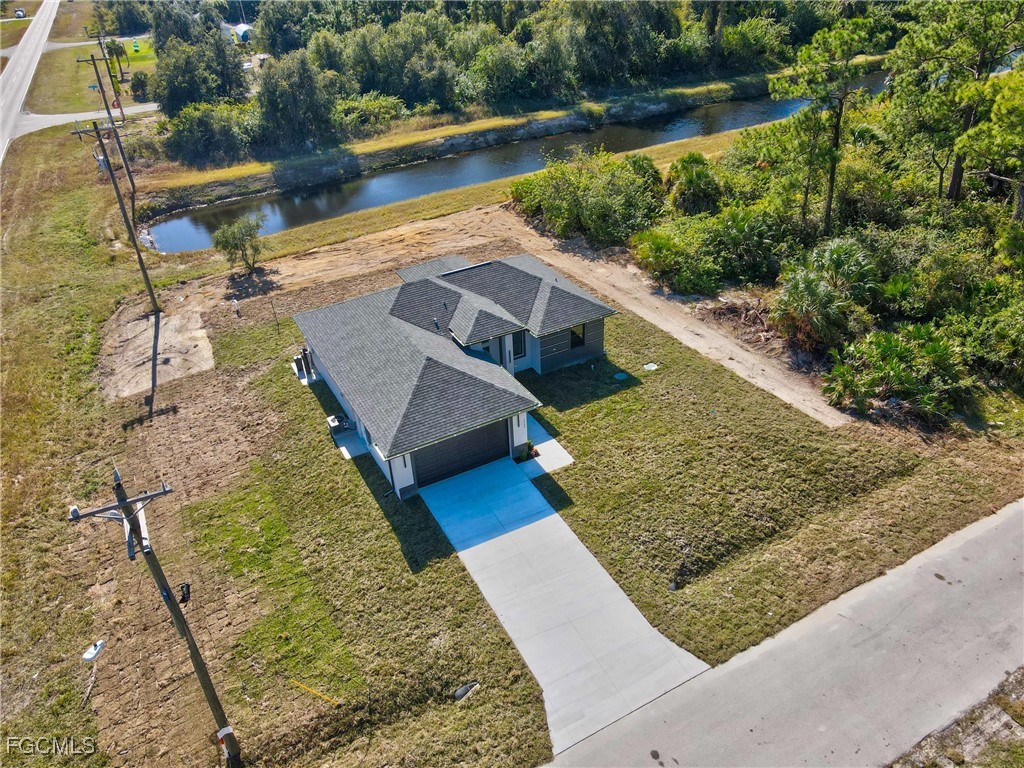 1152 Randolph Street Lehigh Acres, FL 33974 - Photo 37 of 50 a view of a yard with wooden floor