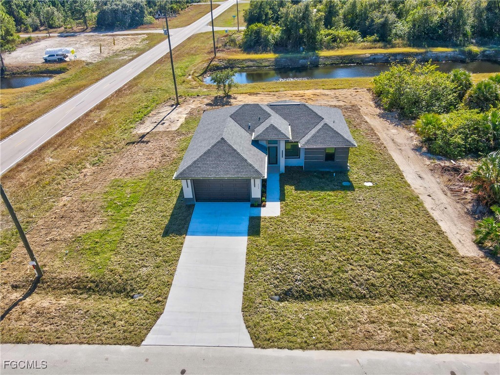 1152 Randolph Street Lehigh Acres, FL 33974 - Photo 38 of 50 a view of a house with pool