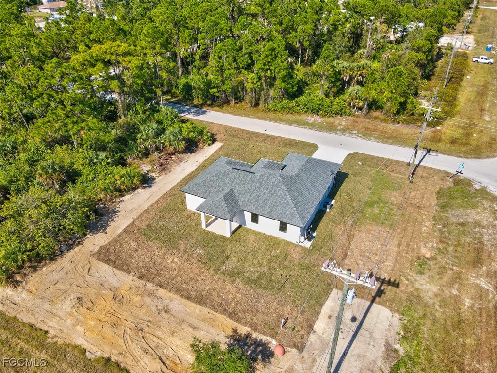 1152 Randolph Street Lehigh Acres, FL 33974 - Photo 39 of 50 a view of a yard with an outdoor space