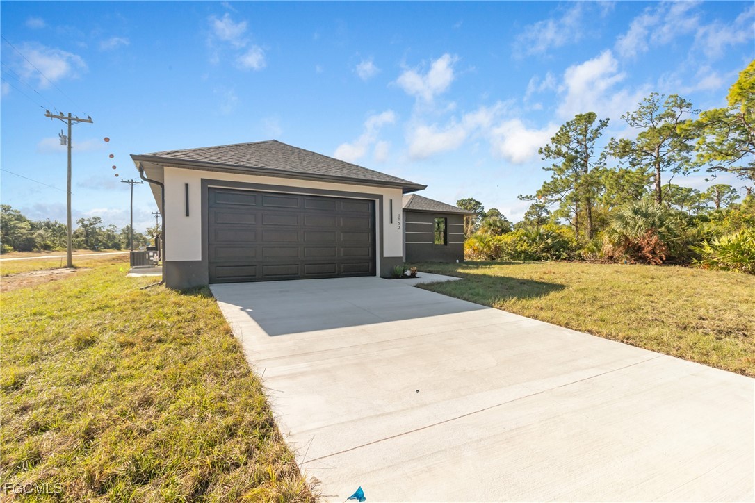 1152 Randolph Street Lehigh Acres, FL 33974 - Photo 49 of 50 a view of backyard of the house
