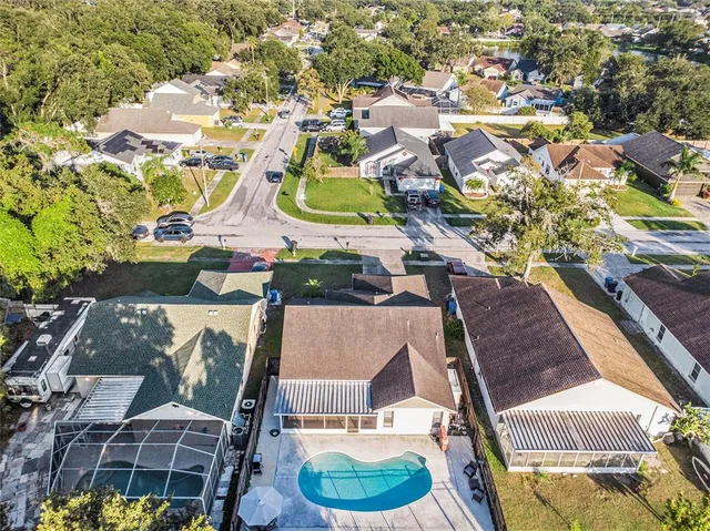 an aerial view of residential houses with outdoor space