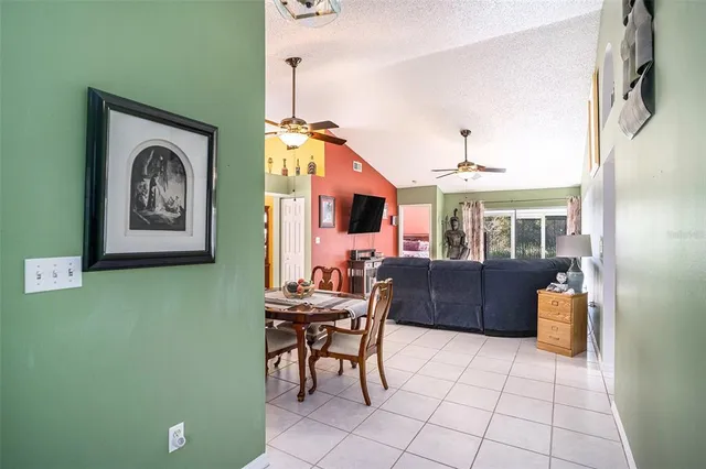 a dining room with furniture and window
