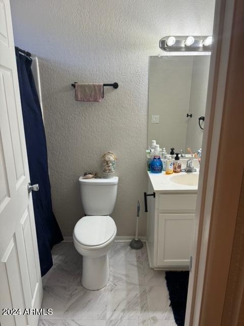 1336 East Mountain View Road, Unit 202 Phoenix, AZ 85020 - Photo 15 of 23 a bathroom with a sink toilet and a mirror