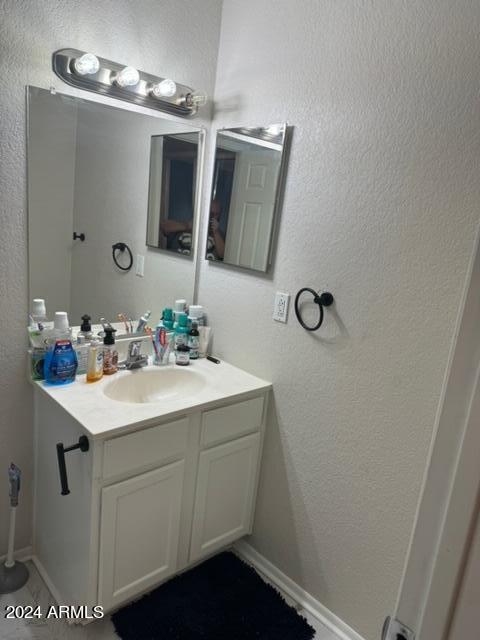 1336 East Mountain View Road, Unit 202 Phoenix, AZ 85020 - Photo 16 of 23 a bathroom with a sink and a mirror