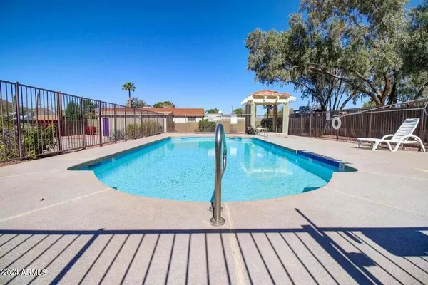 a view of a swimming pool with a patio