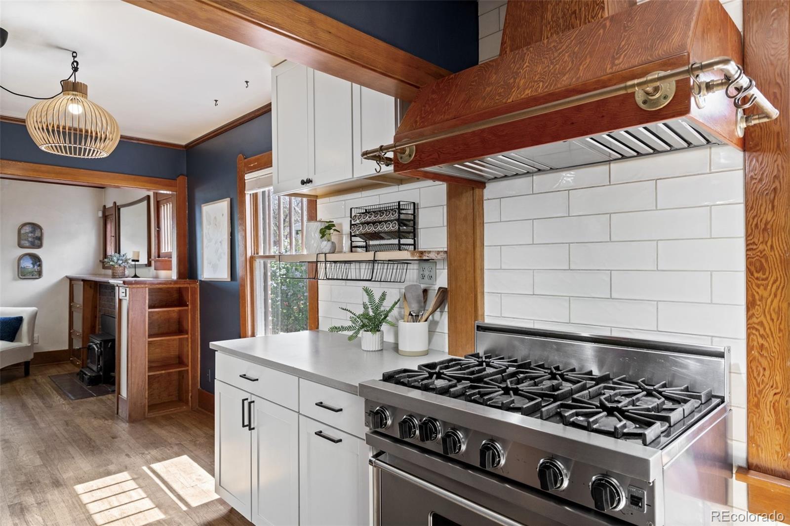 1247 Harrison Street Denver, CO 80206 - Photo 11 of 50 a kitchen with stove and cabinets