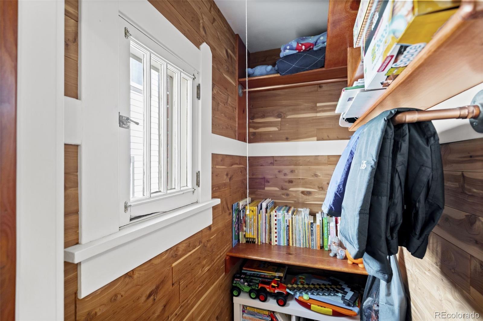 1247 Harrison Street Denver, CO 80206 - Photo 18 of 50 a view of walk in closet with clothes and shoes