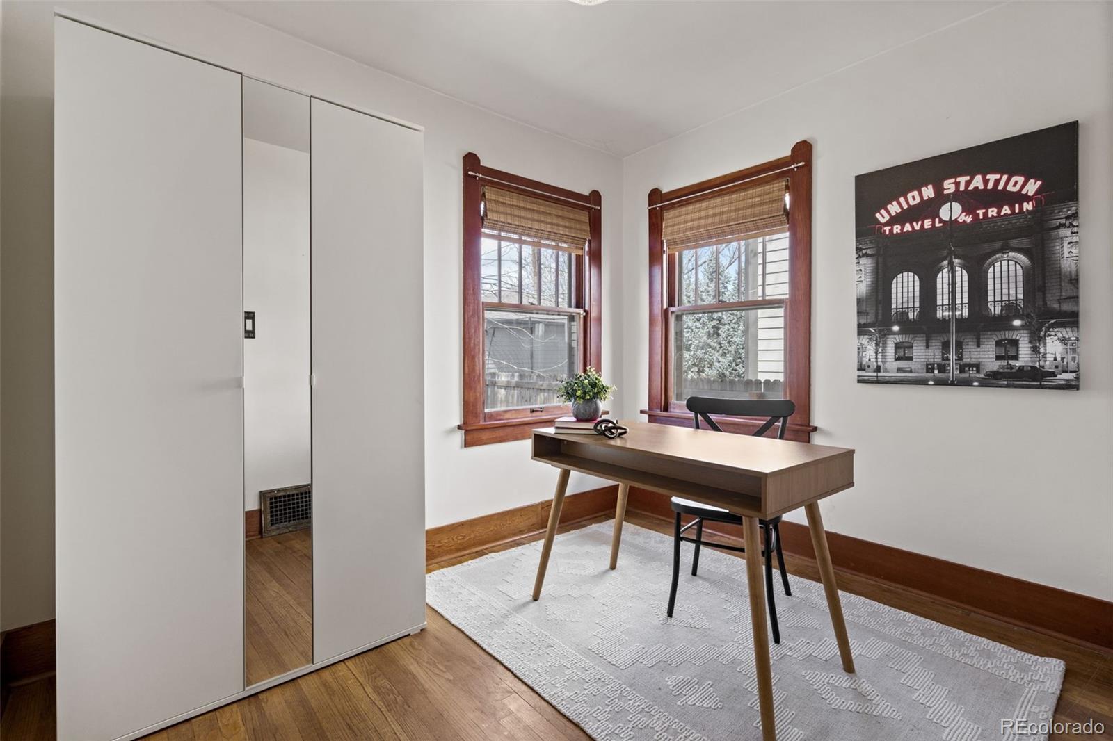 1247 Harrison Street Denver, CO 80206 - Photo 20 of 50 a view of a room with furniture window and wooden floor