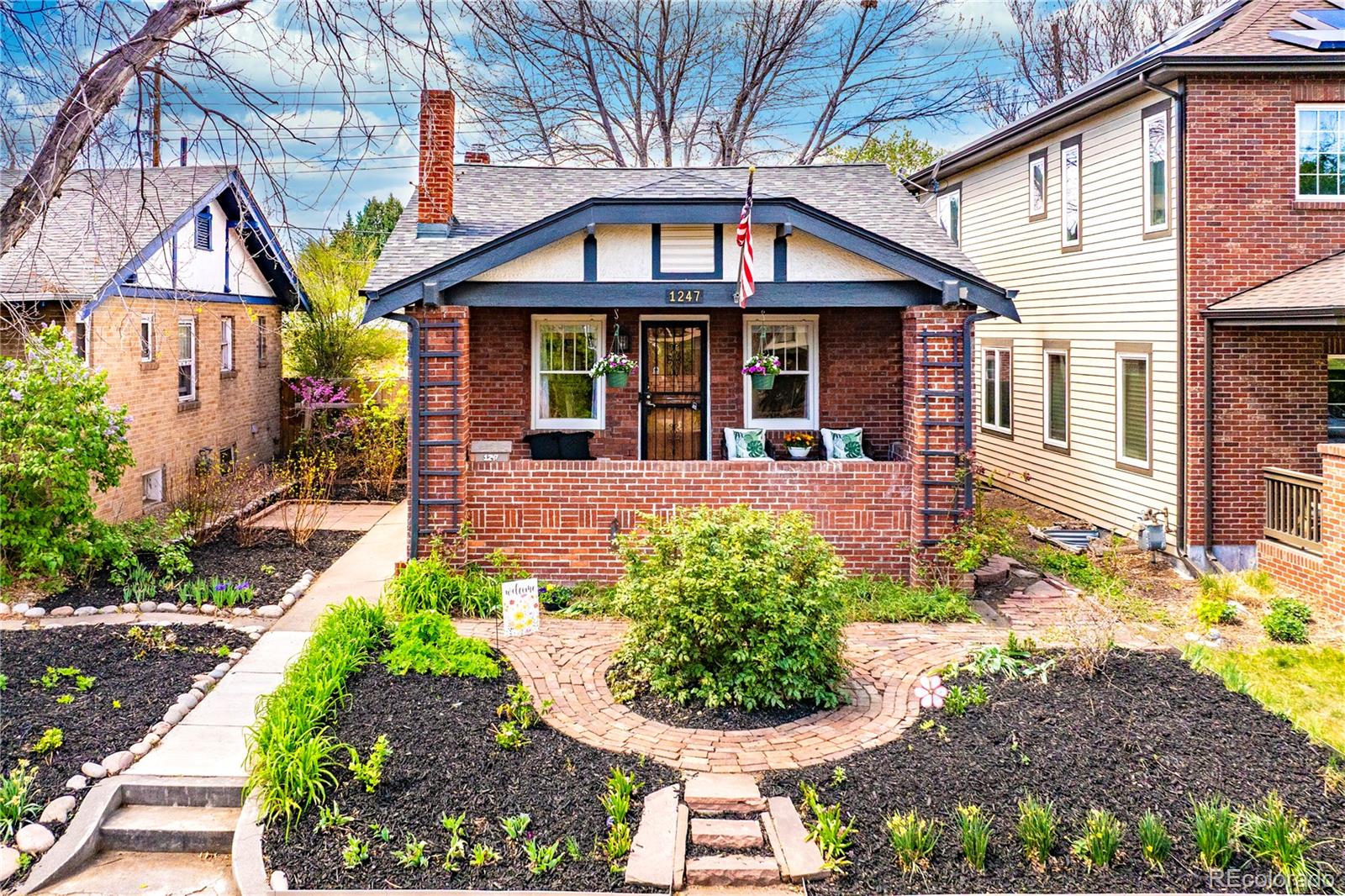 1247 Harrison Street Denver, CO 80206 - Photo 2 of 50 a front view of a house