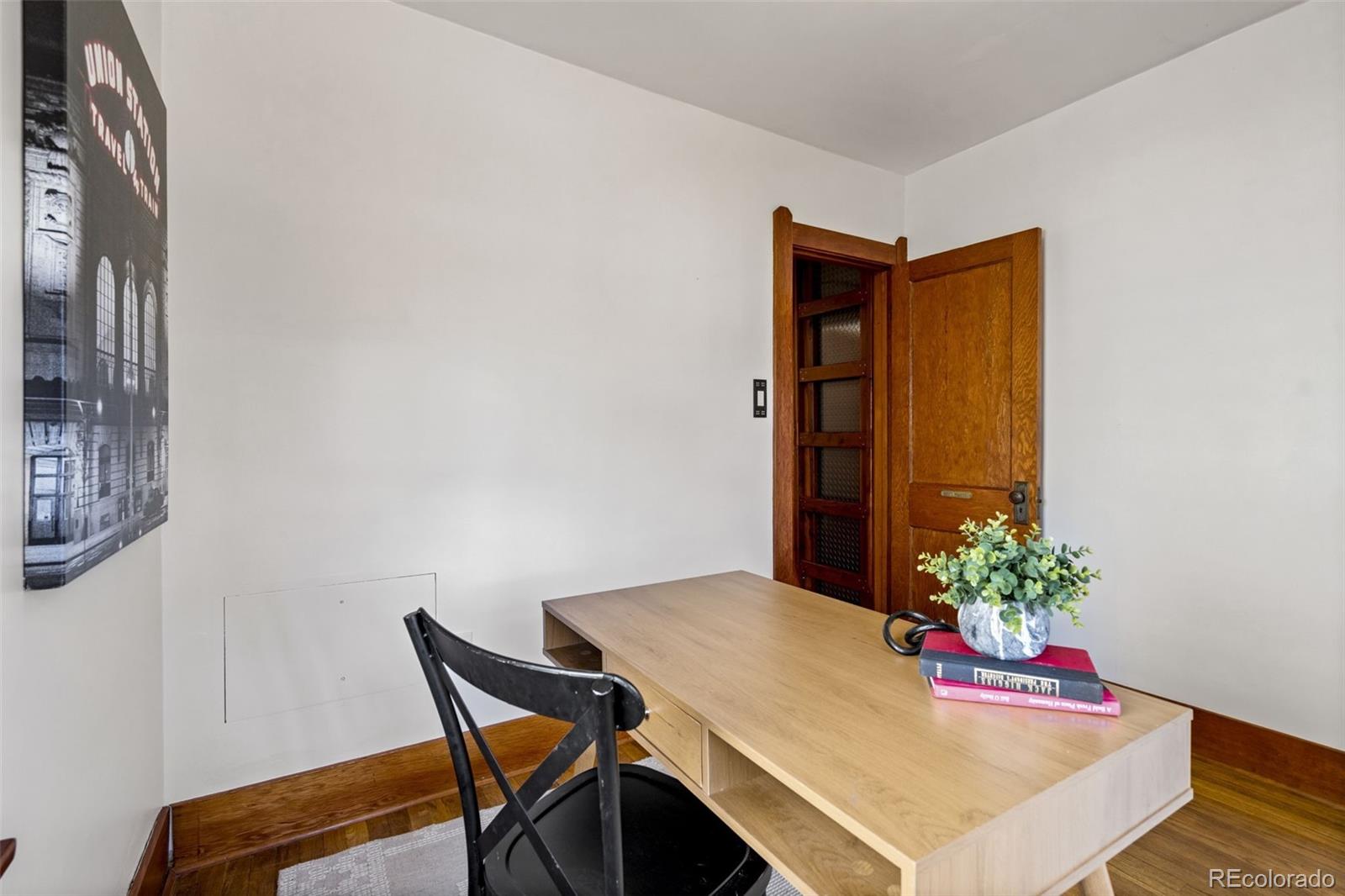 1247 Harrison Street Denver, CO 80206 - Photo 22 of 50 a workspace with furniture and wooden floor