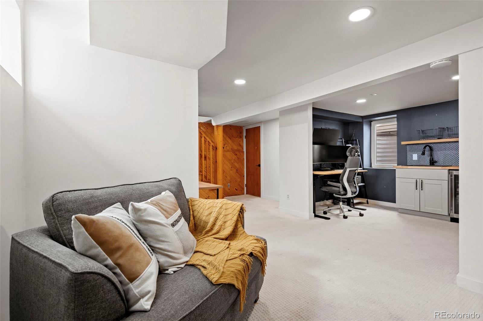 1247 Harrison Street Denver, CO 80206 - Photo 27 of 50 a view of a livingroom with workspace and a couch
