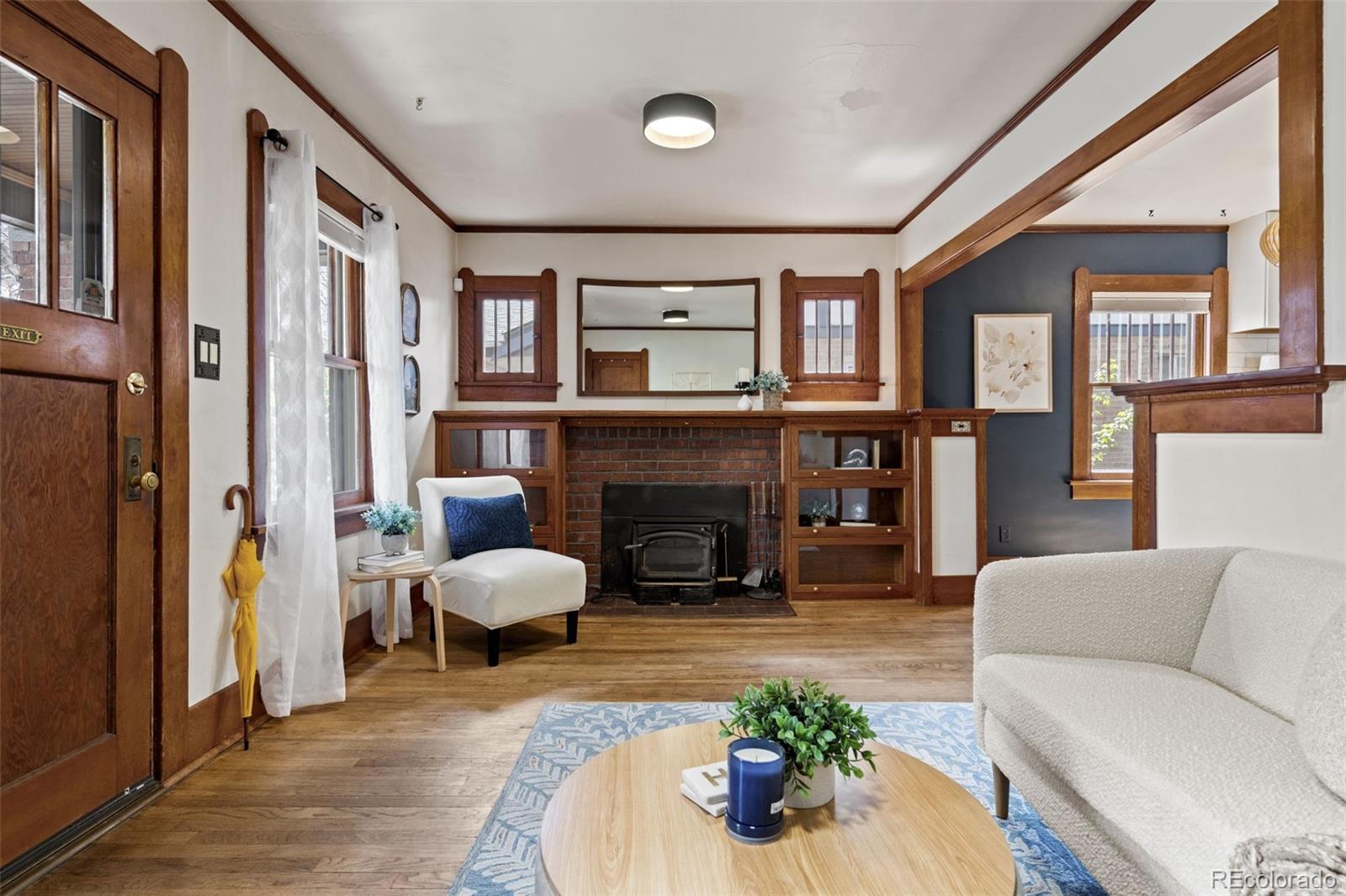 1247 Harrison Street Denver, CO 80206 - Photo 5 of 50 a living room with furniture and a fireplace