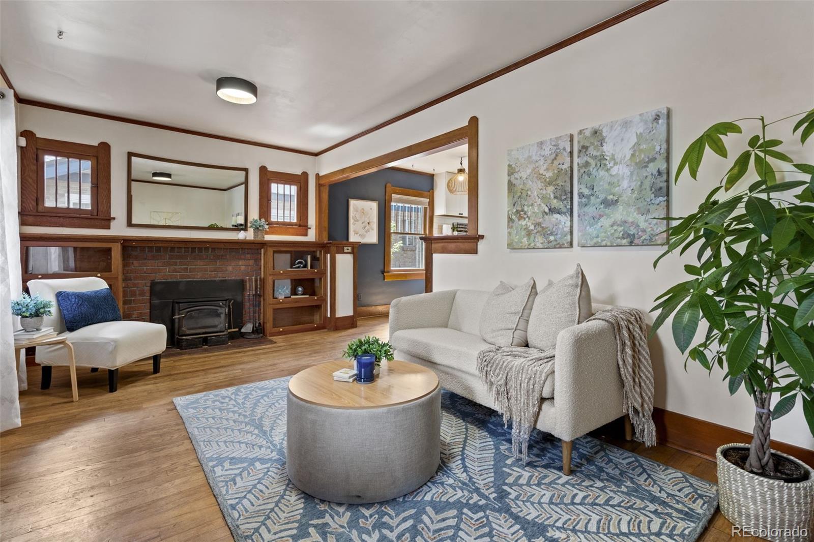1247 Harrison Street Denver, CO 80206 - Photo 6 of 50 a living room with furniture and a fireplace
