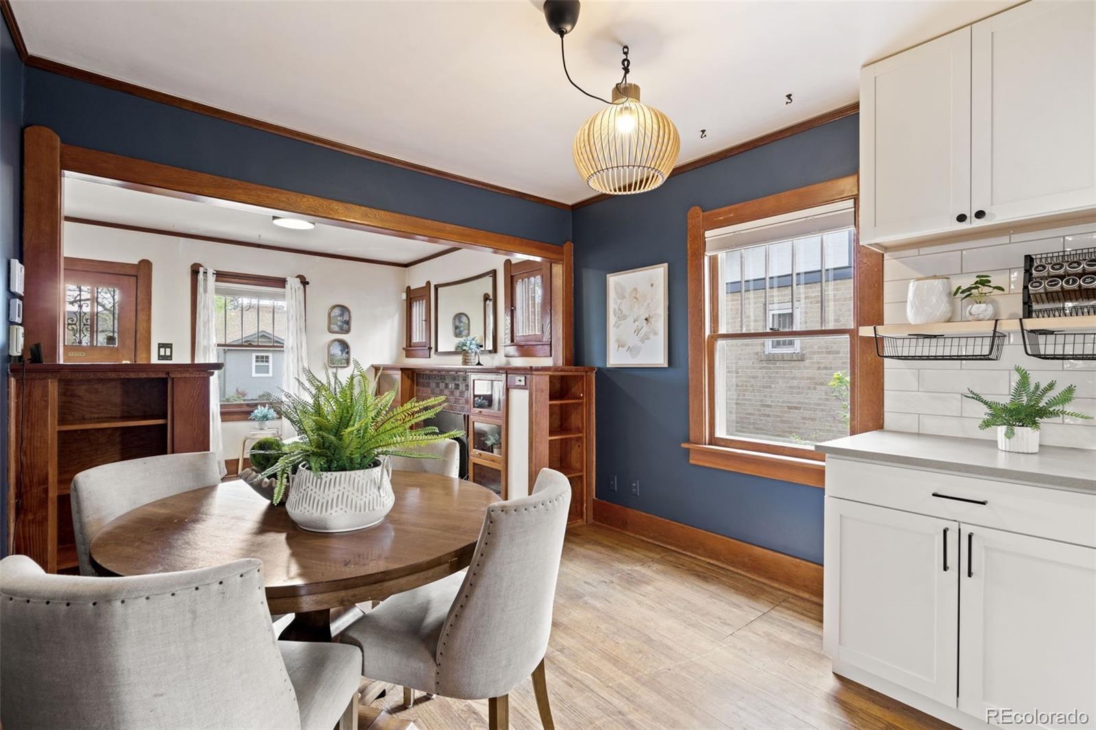 1247 Harrison Street Denver, CO 80206 - Photo 9 of 50 a view of a dining room with furniture window and wooden floor