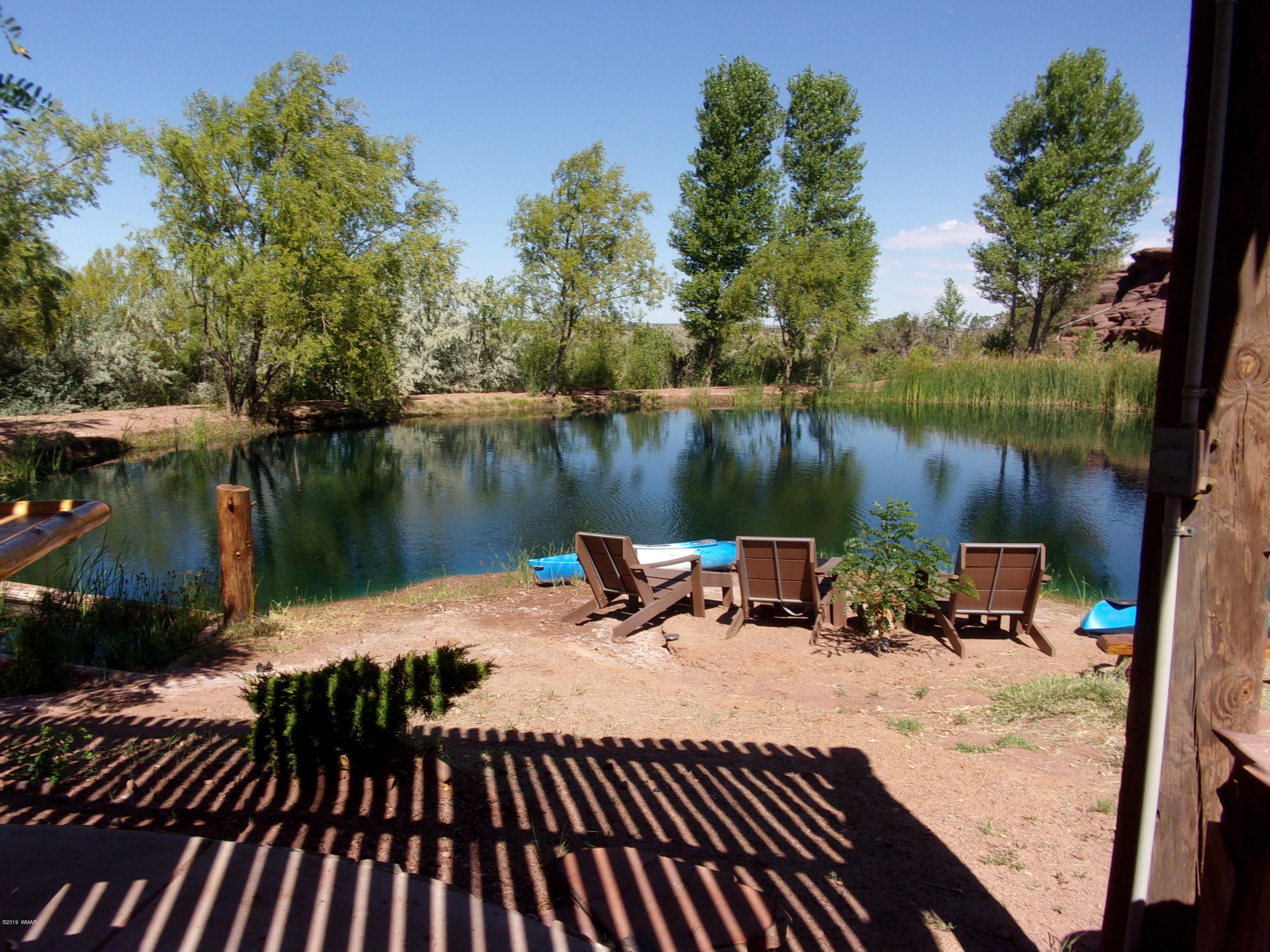 4755 Dia Estrella Road Snowflake, AZ 85937 - Photo 8 of 50 a view of a lake with wooden deck and lake view