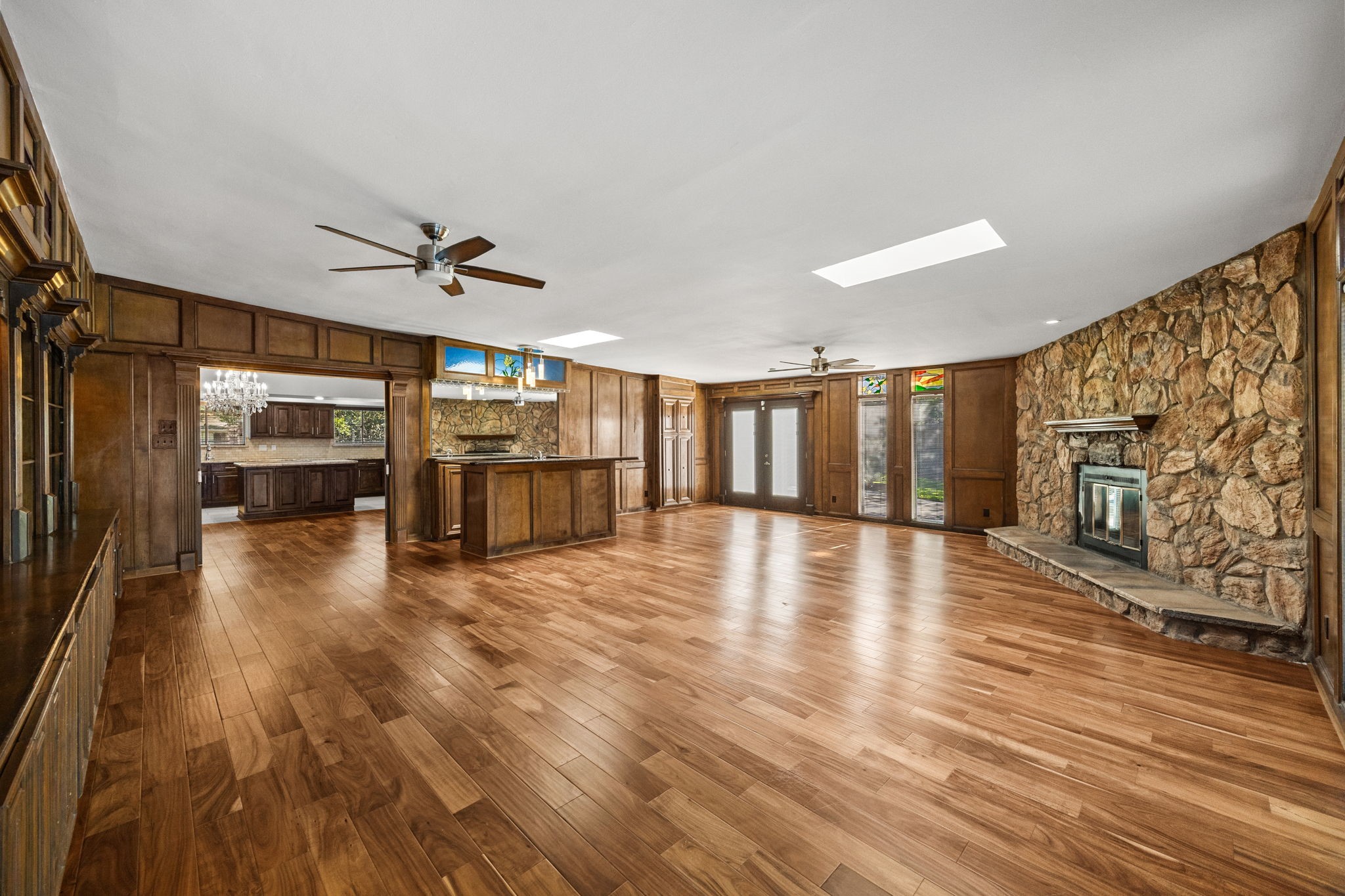 10310 Mayfield Road Houston, TX 77043 - Photo 16 of 49 Awesome spacious paneled family room features wood-burning fireplace, bar area, doors to back yard