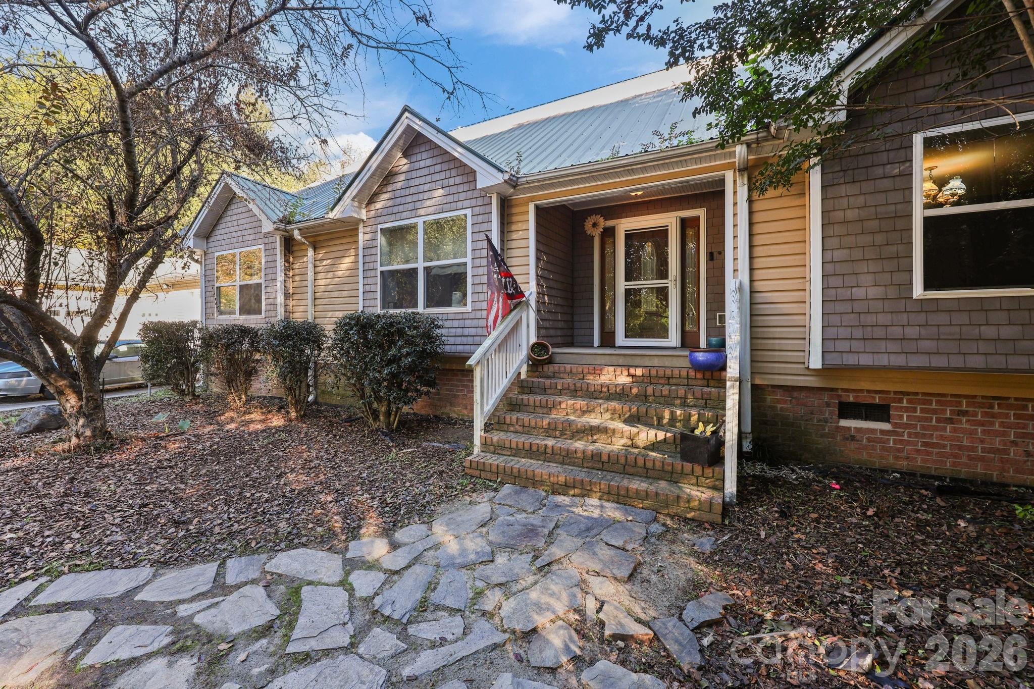 a front view of a house with garden