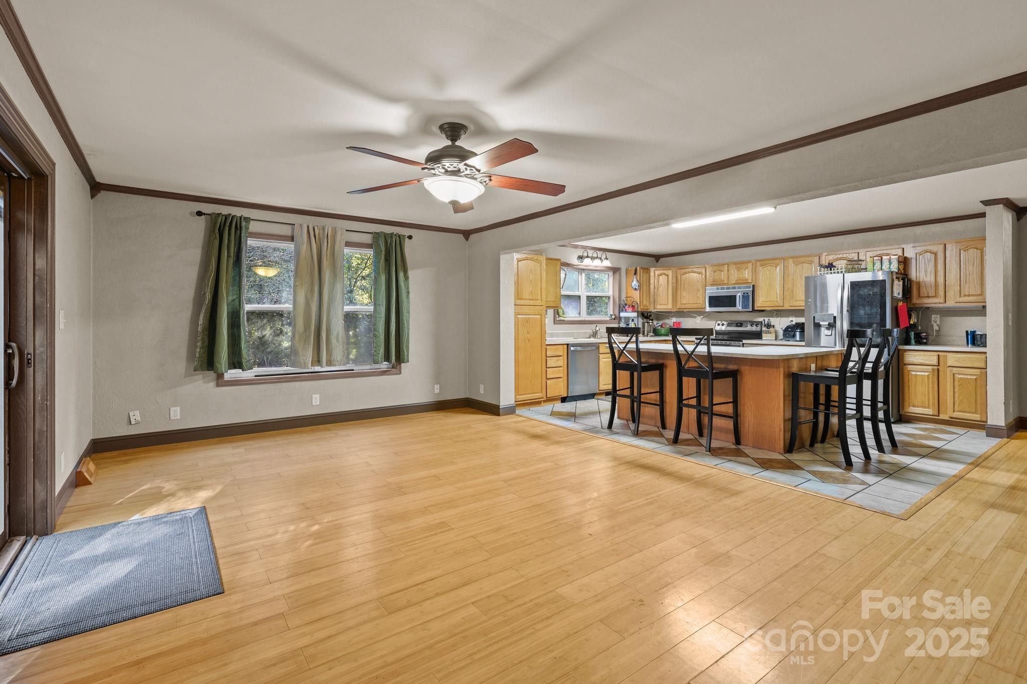 952 Flat Swamp Road Denton, NC 27239 - Photo 11 of 37 a view of a kitchen with a stove cabinets and wooden floor