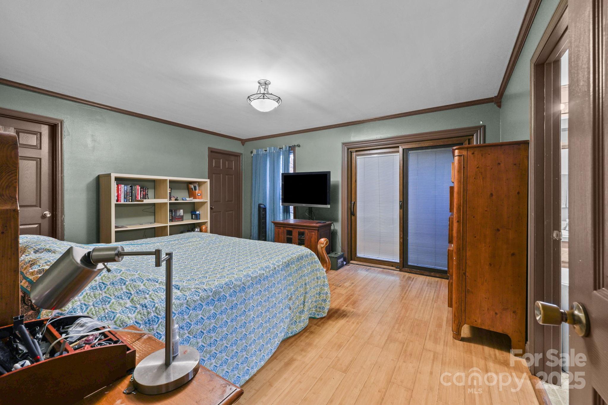 952 Flat Swamp Road Denton, NC 27239 - Photo 13 of 37 a bed room with a bed and a television