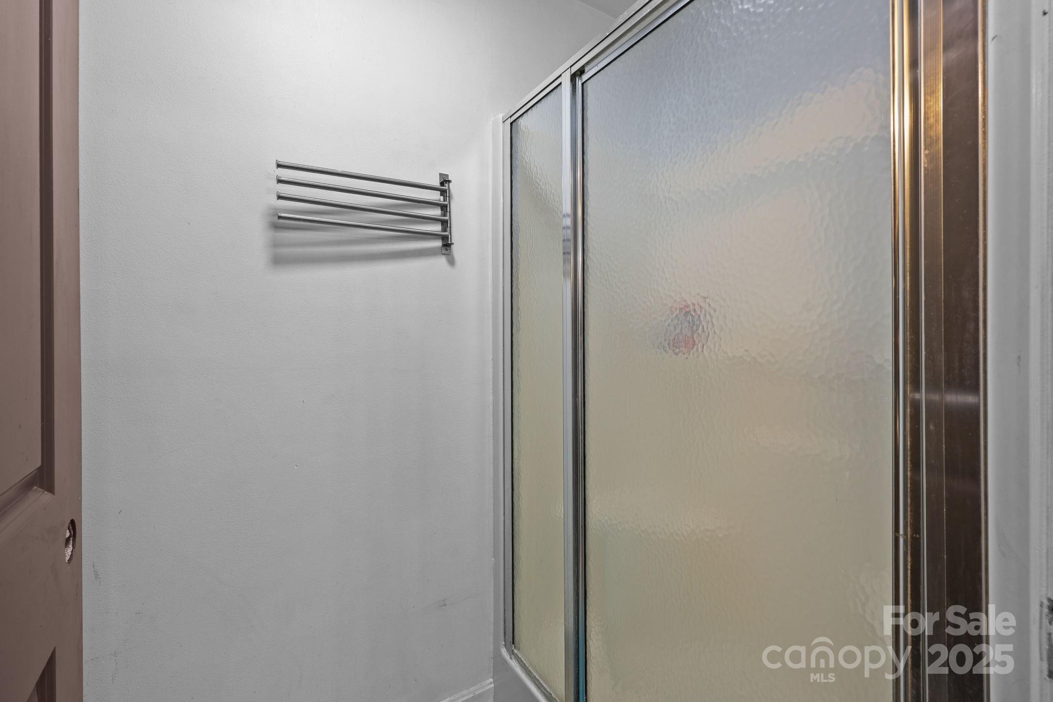 952 Flat Swamp Road Denton, NC 27239 - Photo 17 of 37 a bathroom with a shower and a mirror