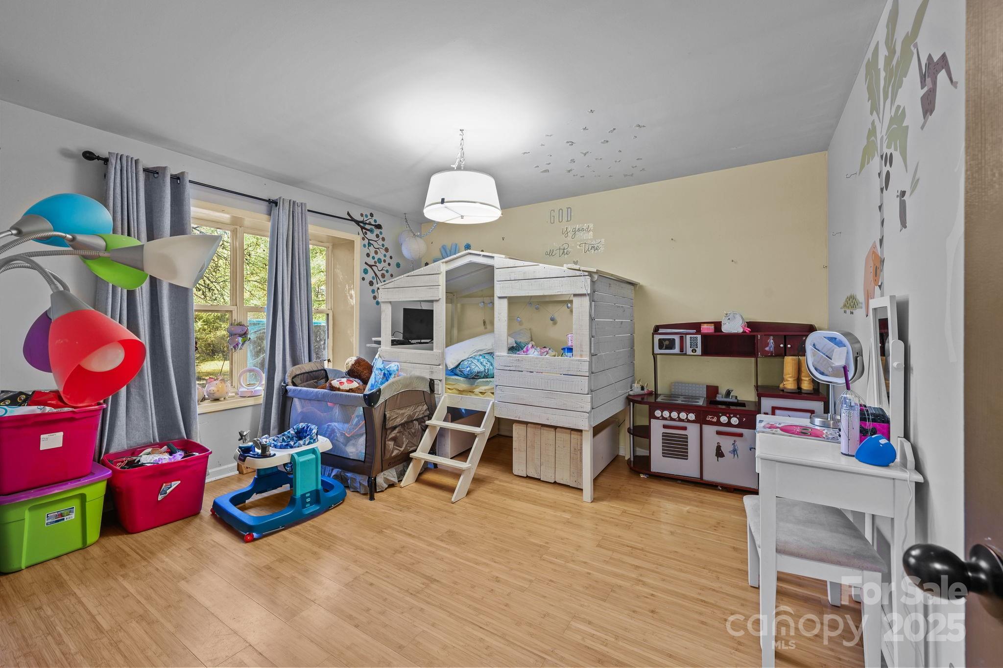 952 Flat Swamp Road Denton, NC 27239 - Photo 19 of 37 a view of a room with furniture wooden floor and a chandelier