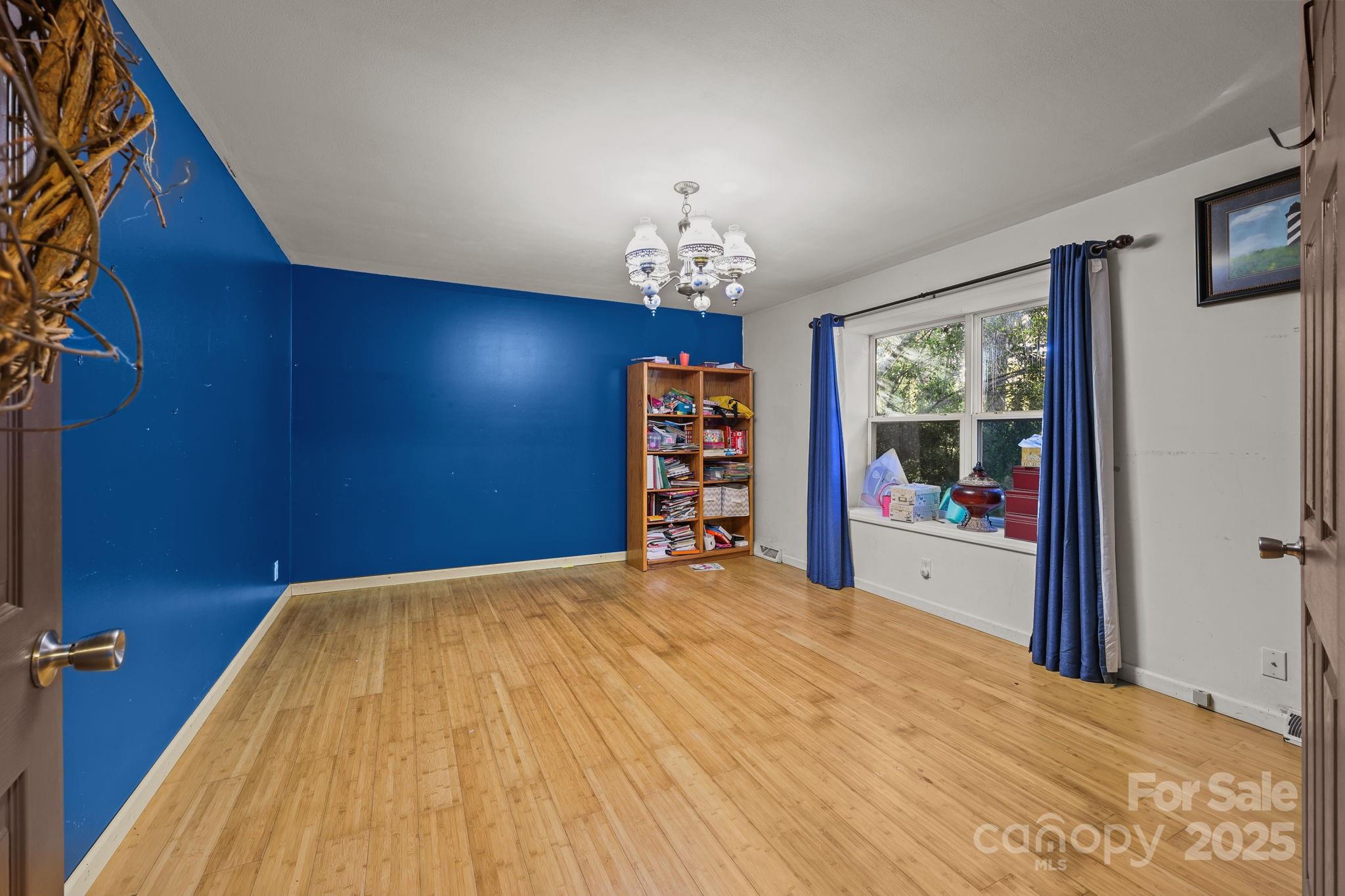 952 Flat Swamp Road Denton, NC 27239 - Photo 21 of 37 a view of a bedroom with a bed and a window