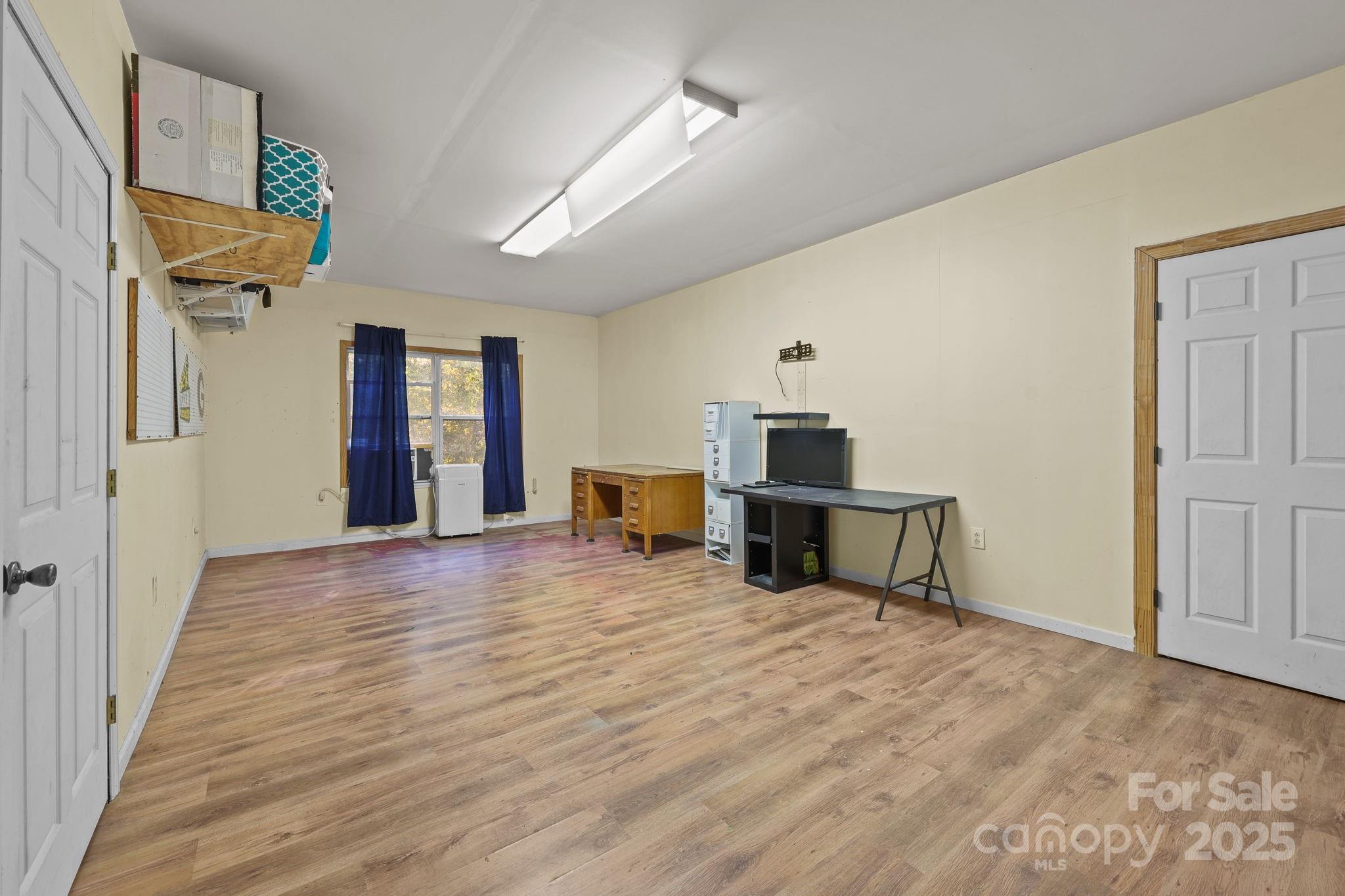 952 Flat Swamp Road Denton, NC 27239 - Photo 22 of 37 a view of a livingroom with wooden floor and furniture