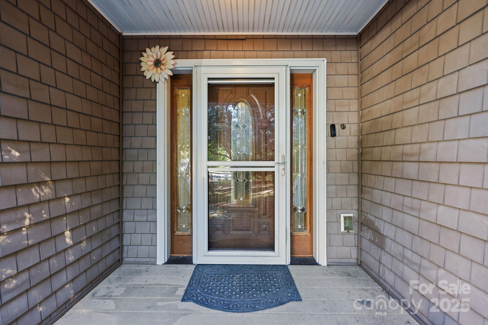 952 Flat Swamp Road Denton, NC 27239 - Photo 4 of 37 a view of a hallway with wooden shelves