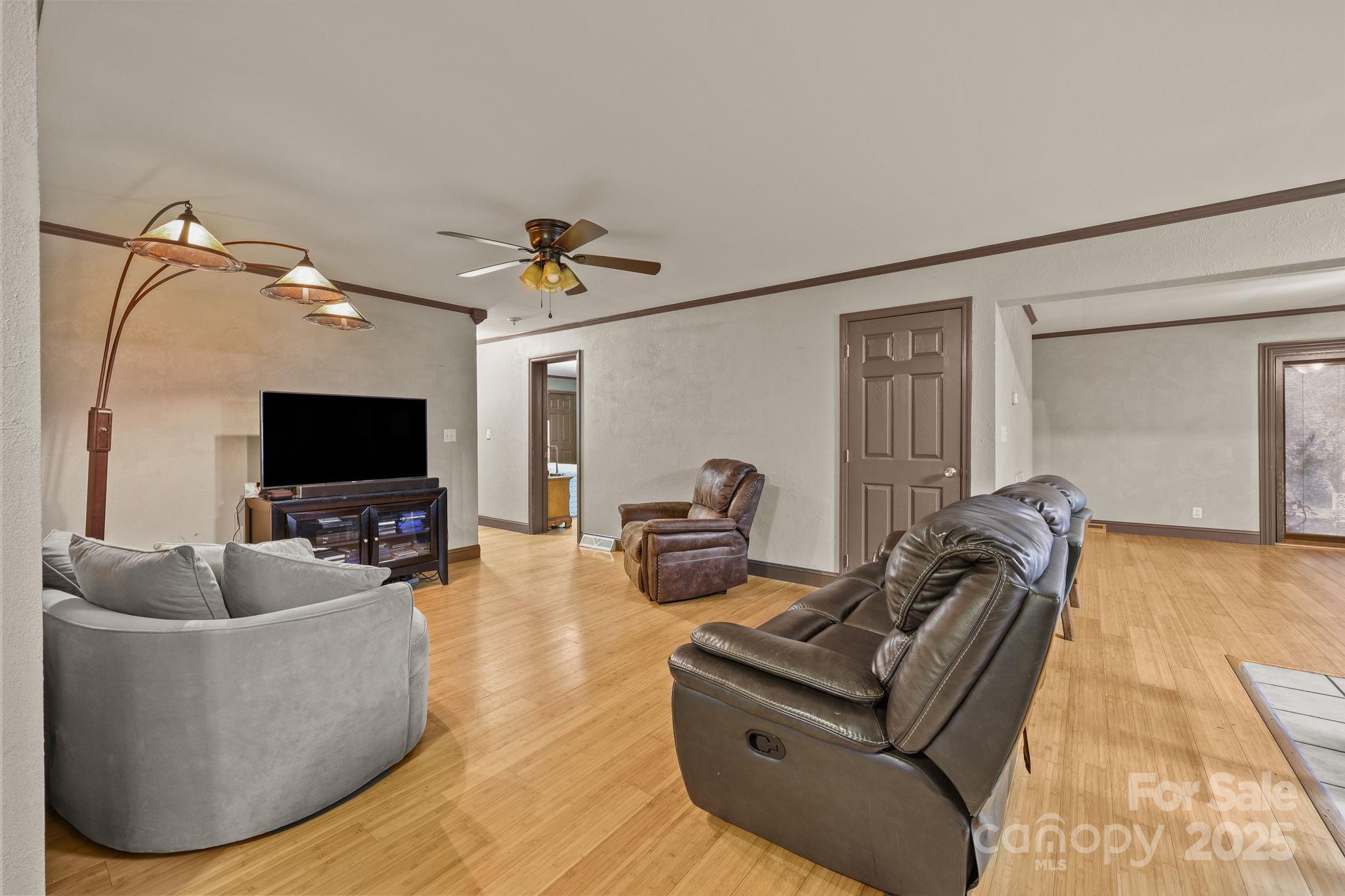 952 Flat Swamp Road Denton, NC 27239 - Photo 6 of 37 a living room with furniture and a flat screen tv