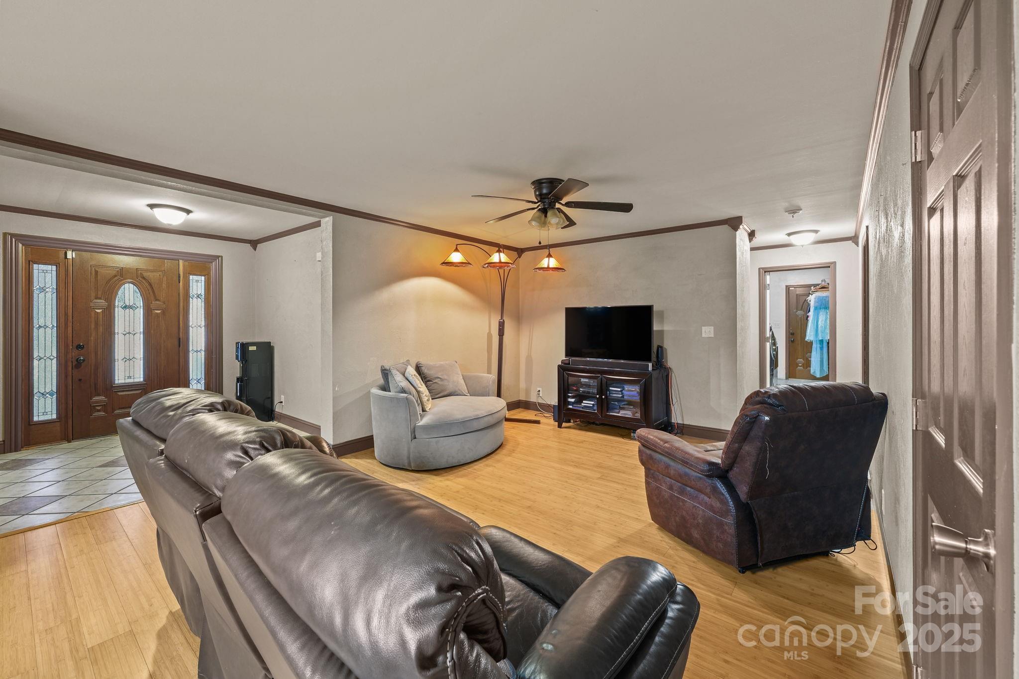 952 Flat Swamp Road Denton, NC 27239 - Photo 7 of 37 a living room with furniture and a flat screen tv