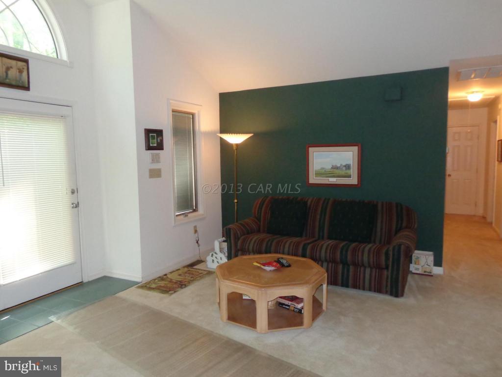 183 Windjammer Road Berlin, MD 21811 - Photo 4 of 18 a living room with a couch and a table