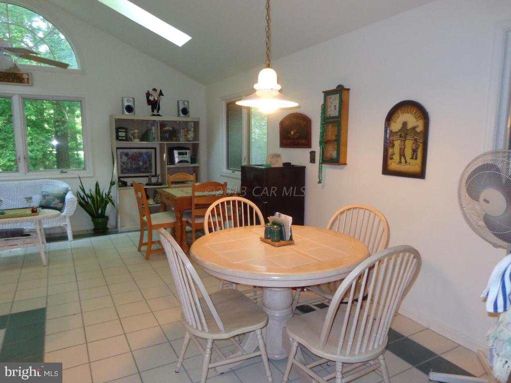 183 Windjammer Road Berlin, MD 21811 - Photo 5 of 18 a view of a dining room with furniture
