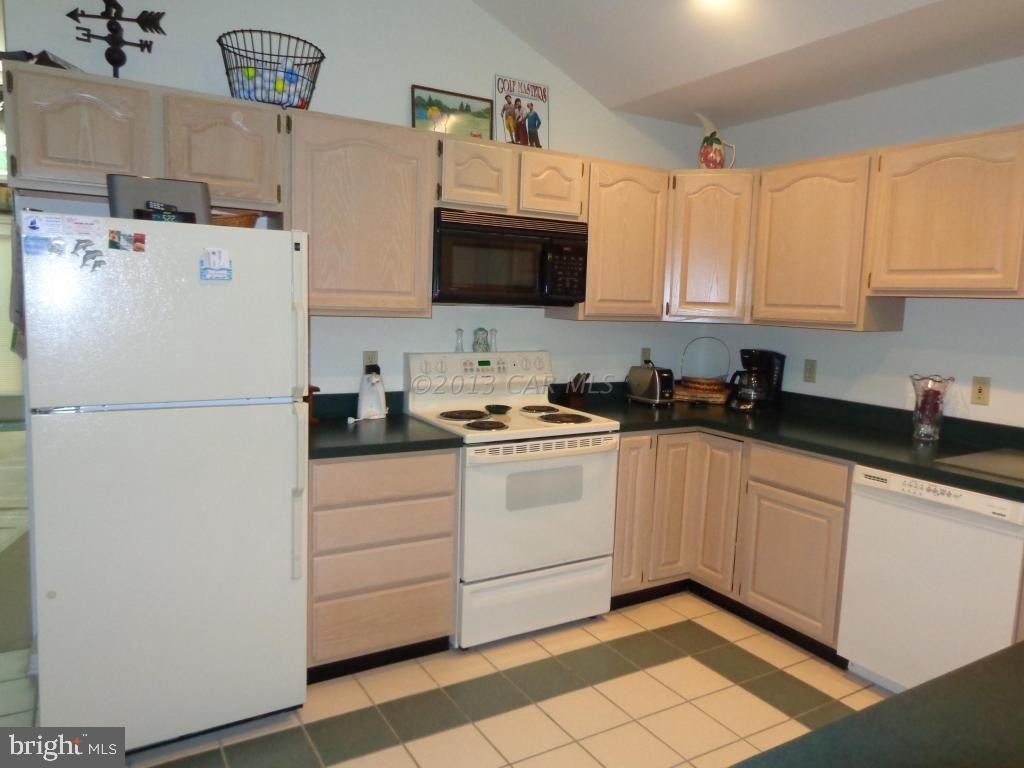183 Windjammer Road Berlin, MD 21811 - Photo 8 of 18 a kitchen with cabinets appliances and a counter space