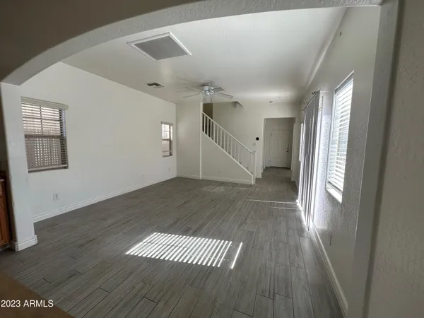 a view of entryway and hall with wooden floor