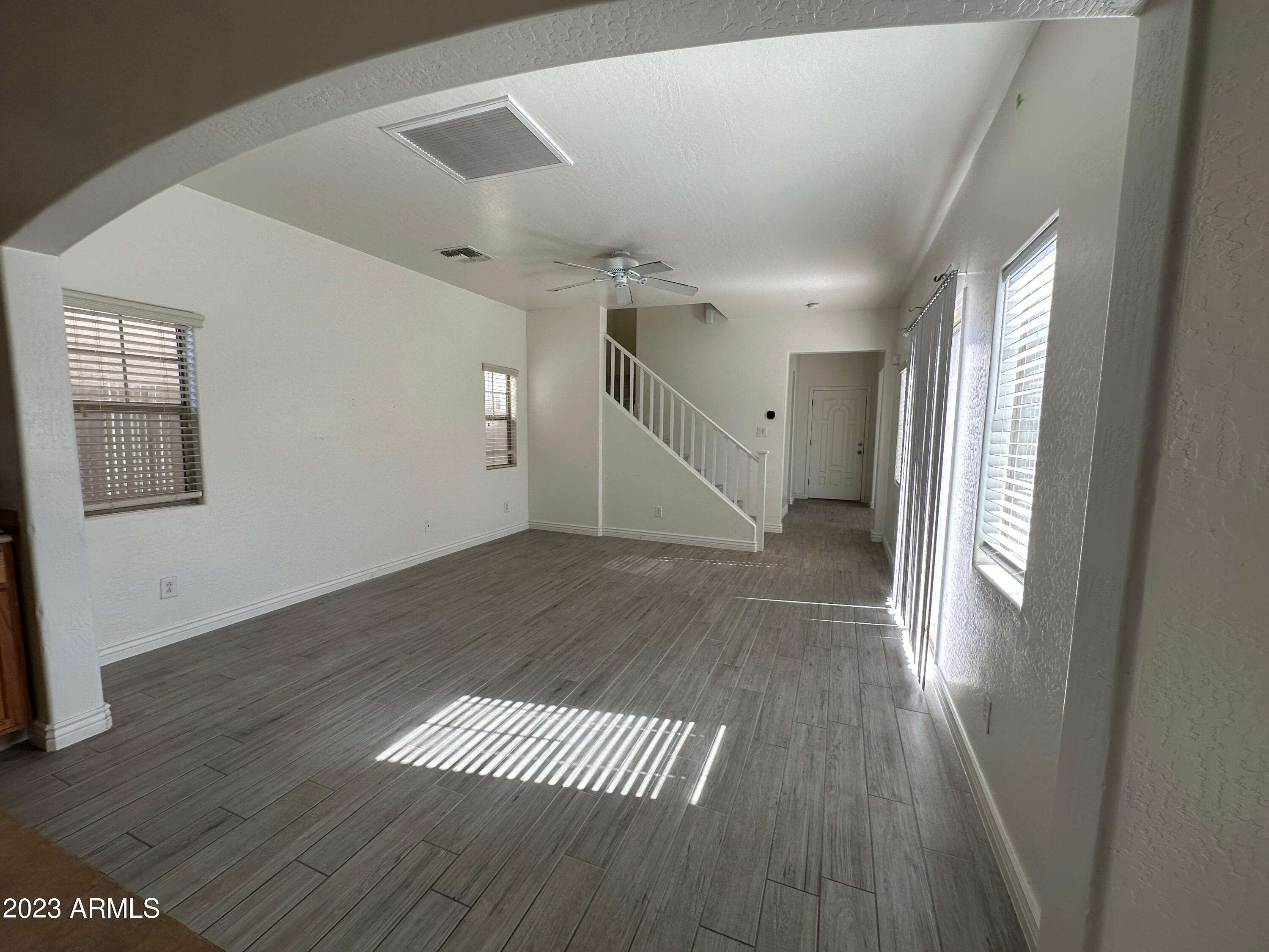 4734 East Olney Avenue Gilbert, AZ 85234 - Photo 11 of 26 a view of entryway and hall with wooden floor