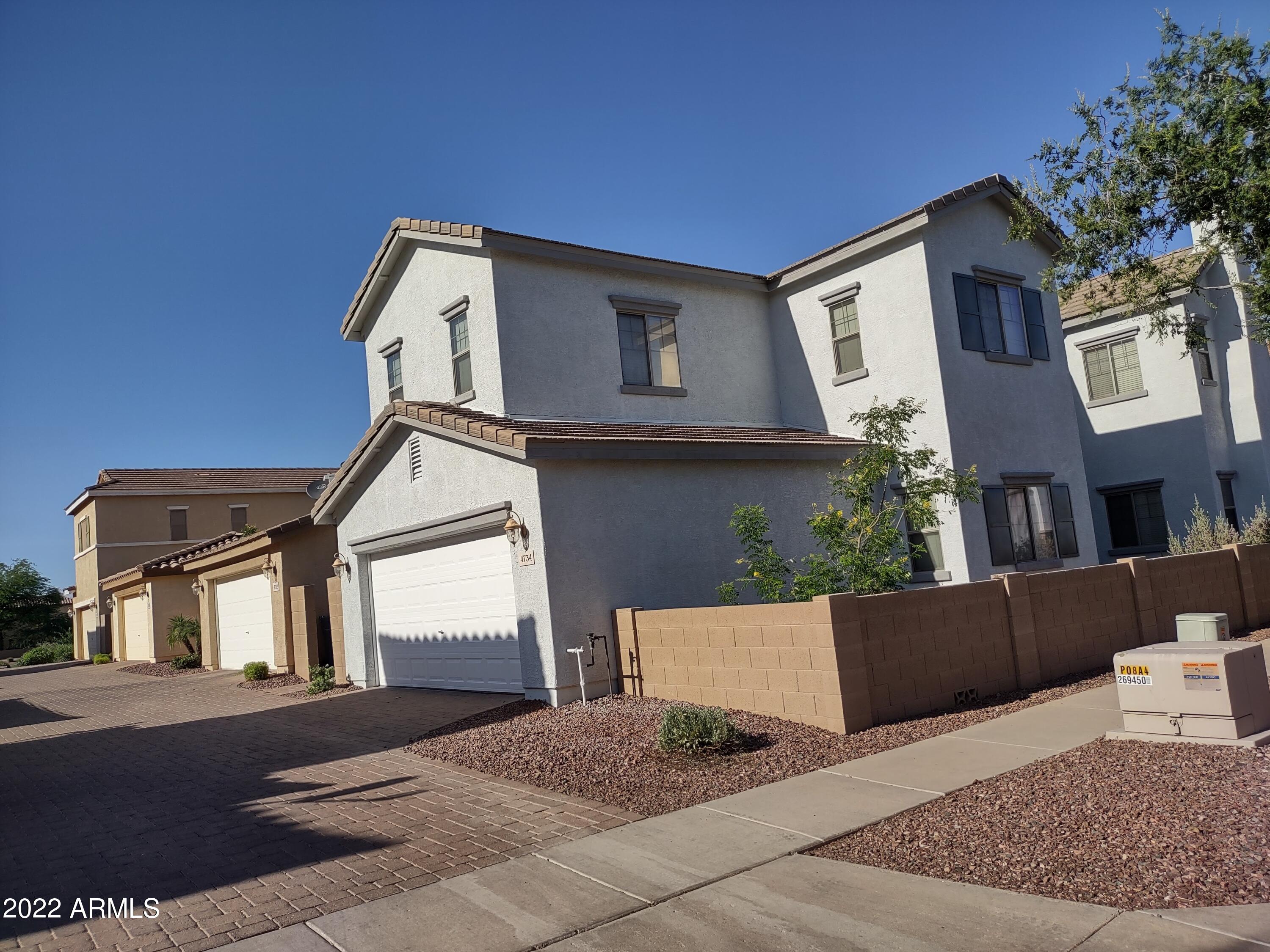 4734 East Olney Avenue Gilbert, AZ 85234 - Photo 2 of 26 a front view of a house with entryway